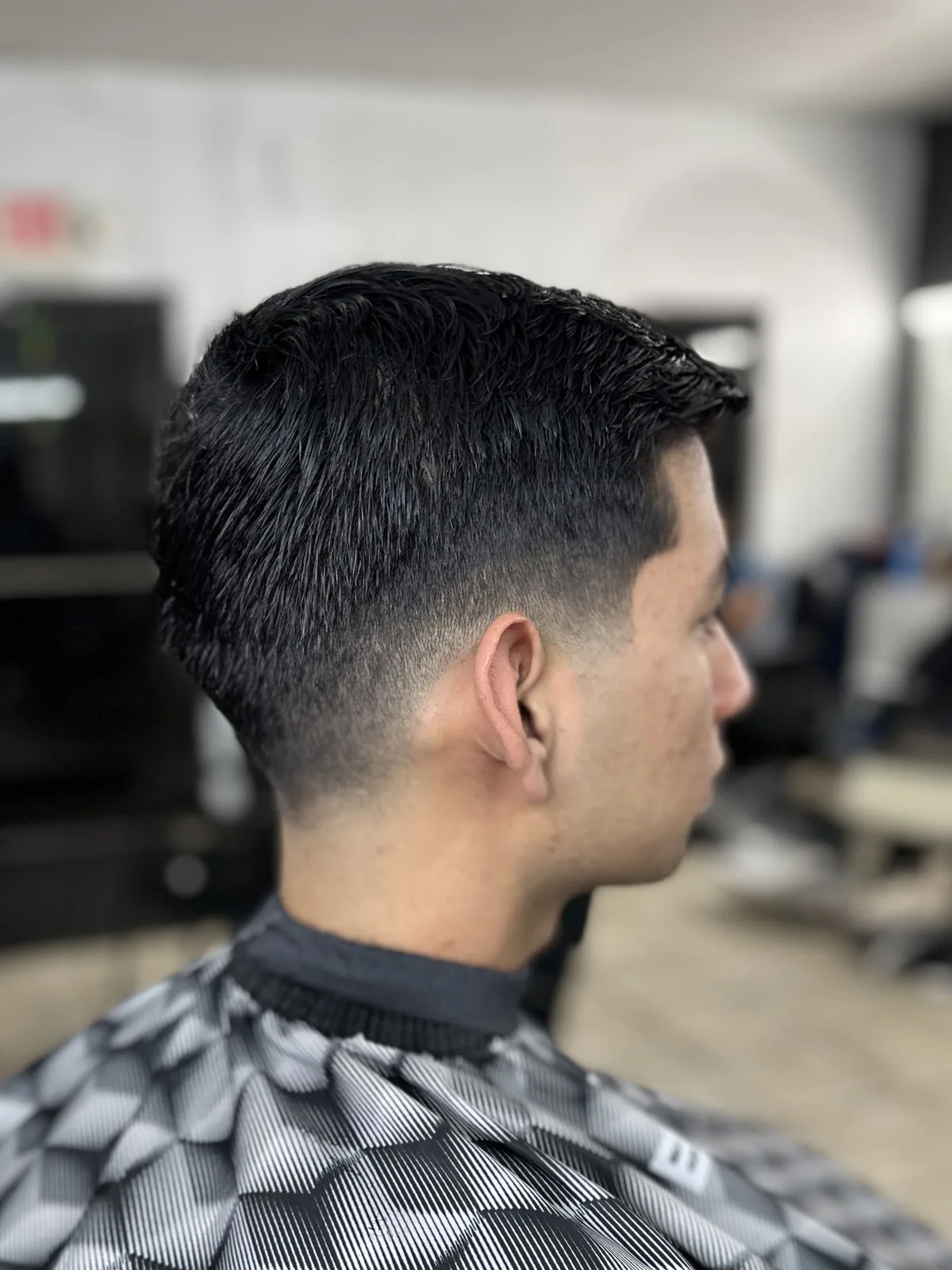 Classic low fade with a clean blend and textured short top