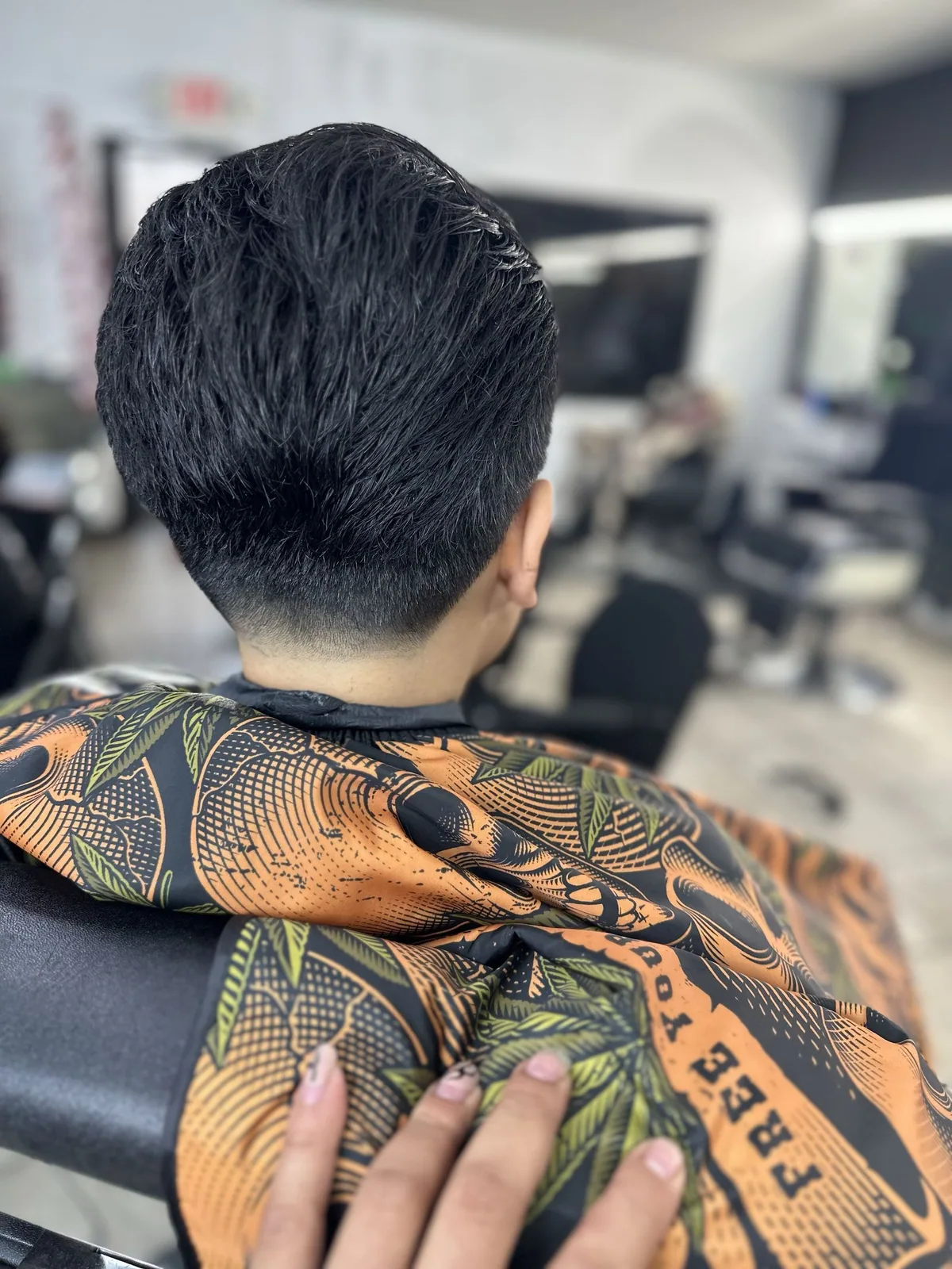 Clean back taper blended into a neatly styled top