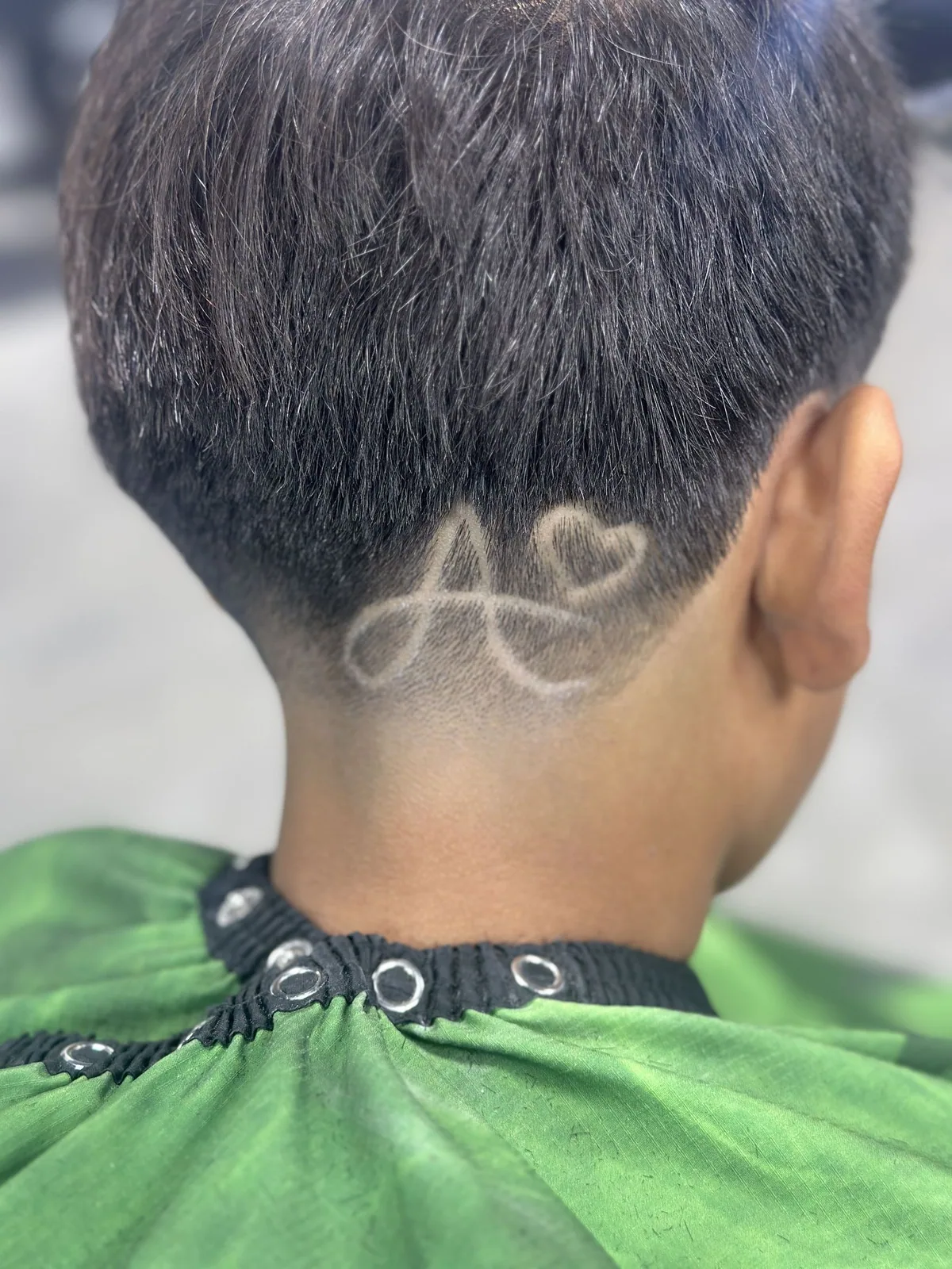 Custom infinity-style design carved into a tapered neckline