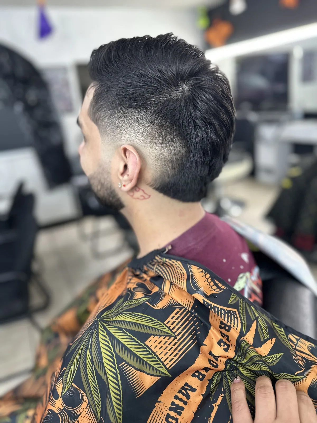 Precision drop fade with a longer, slicked-back top