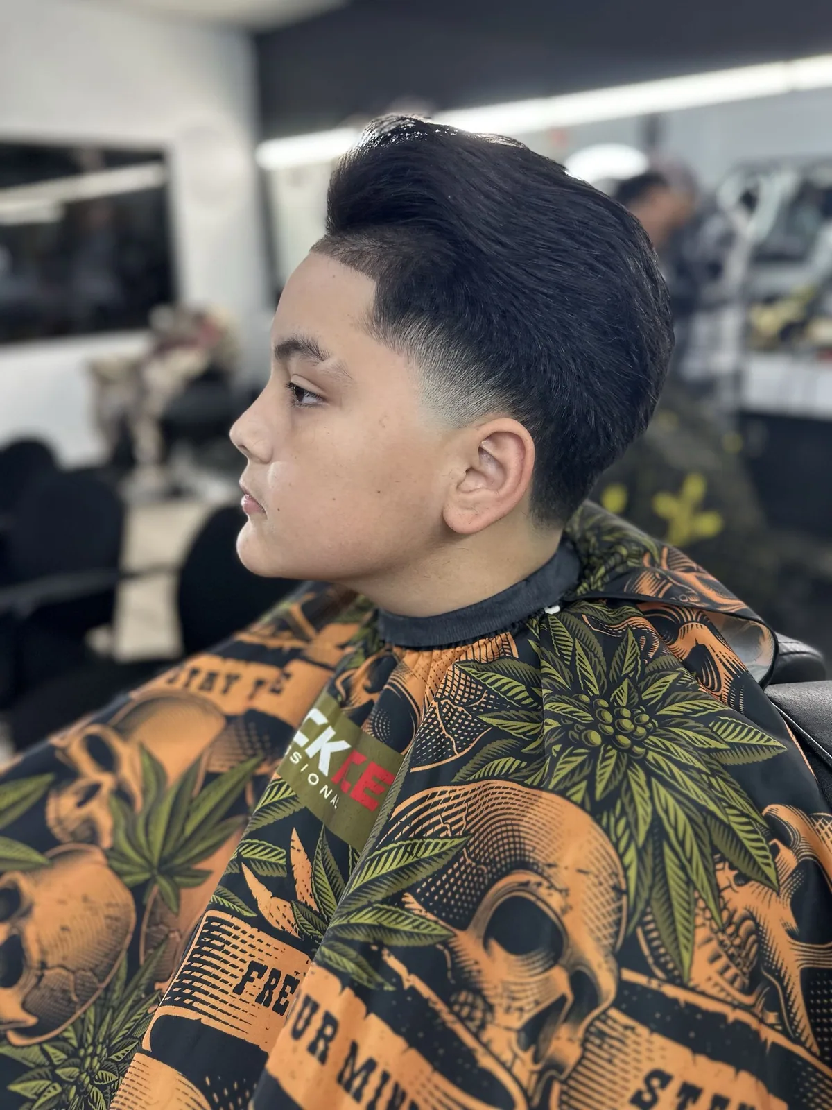 Sculpted taper with a brushed-back top and sharp front line